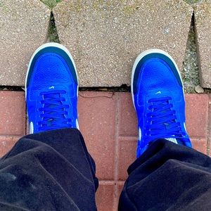 Nike Air Force 1’s black, blue, white, and silver